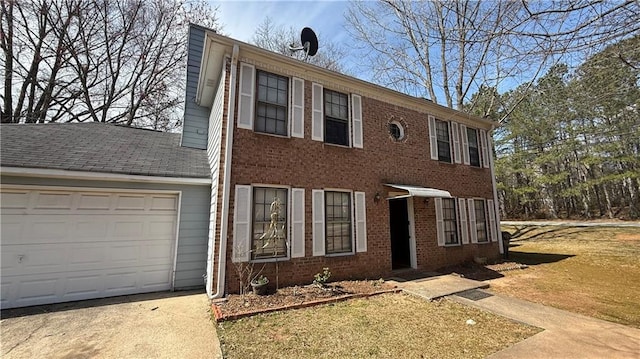 colonial house featuring brick siding, a chimney, concrete driveway, and an attached garage