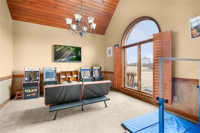 104 Aspen Dr NE, Calhoun, GA 30701 - living room with a wainscoted wall, lofted ceiling, carpet floors, wood ceiling, and a chandelier