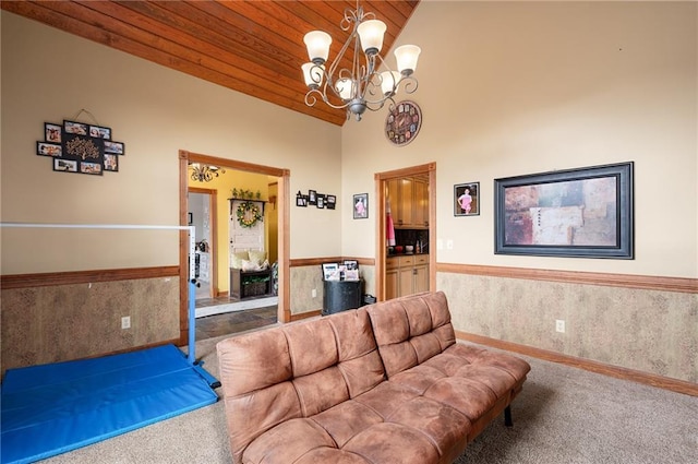 104 Aspen Dr NE, Calhoun, GA 30701 - living room with carpet flooring, wainscoting, a chandelier, high vaulted ceiling, and wood ceiling