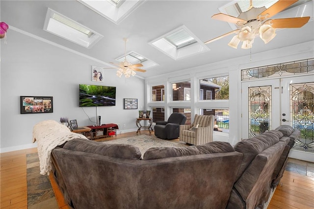 104 Aspen Dr NE, Calhoun, GA 30701 - living room featuring a skylight, ceiling fan, baseboards, crown molding, and vaulted ceiling
