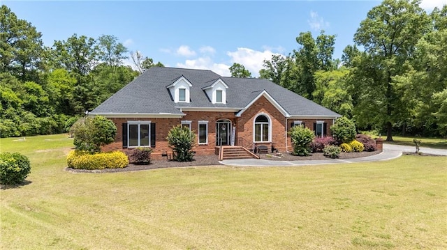 104 Aspen Dr NE, Calhoun, GA 30701 - view of front of house featuring brick siding and a front lawn