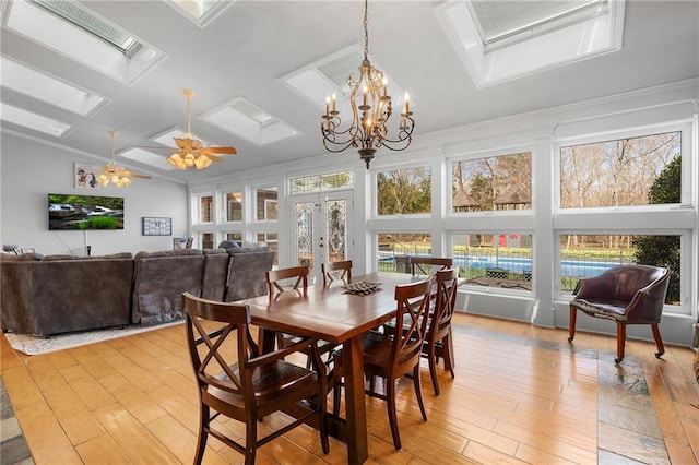 104 Aspen Dr NE, Calhoun, GA 30701 - dining space with plenty of natural light, light wood-type flooring, french doors, a skylight, and lofted ceiling