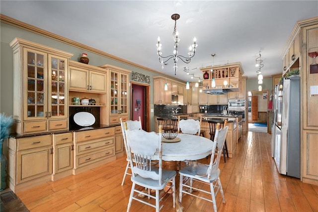 104 Aspen Dr NE, Calhoun, GA 30701 - dining area featuring a chandelier, light wood-style flooring, and crown molding