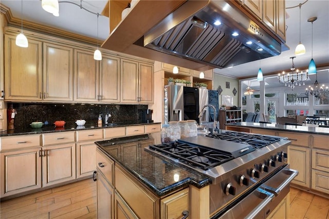 104 Aspen Dr NE, Calhoun, GA 30701 - kitchen featuring premium range hood, tasteful backsplash, a kitchen island with sink, light wood-type flooring, and refrigerator with ice dispenser