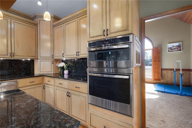 104 Aspen Dr NE, Calhoun, GA 30701 - kitchen with stainless steel double oven, carpet, dark stone counters, a wainscoted wall, and vaulted ceiling