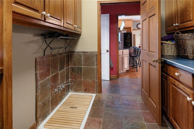 104 Aspen Dr NE, Calhoun, GA 30701 - laundry area featuring stone tile floors