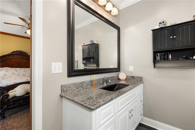 104 Aspen Dr NE, Calhoun, GA 30701 - bathroom featuring crown molding, vanity, ensuite bathroom, baseboards, and ceiling fan