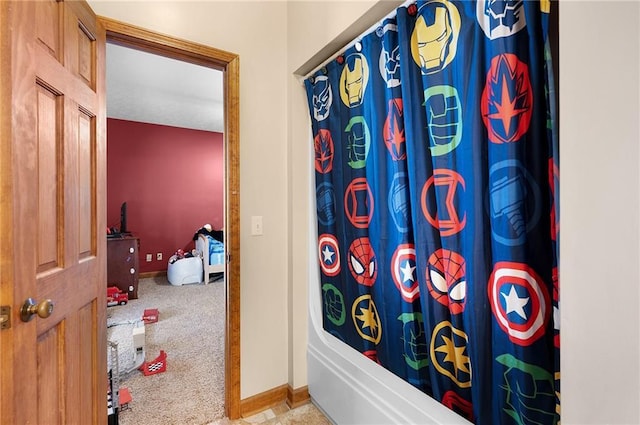104 Aspen Dr NE, Calhoun, GA 30701 - bathroom featuring baseboards and shower / bathtub combination with curtain