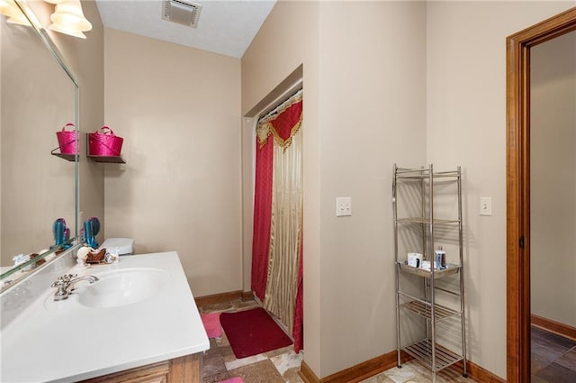 104 Aspen Dr NE, Calhoun, GA 30701 - bathroom with vanity and baseboards