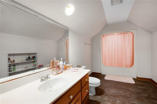 104 Aspen Dr NE, Calhoun, GA 30701 - bathroom with toilet, vanity, lofted ceiling, wood finished floors, and baseboards