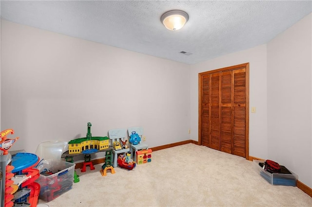 104 Aspen Dr NE, Calhoun, GA 30701 - recreation room with carpet floors, a textured ceiling, and baseboards