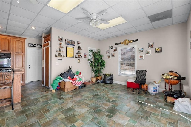 104 Aspen Dr NE, Calhoun, GA 30701 - misc room with a ceiling fan, a paneled ceiling, baseboards, and stone finish flooring