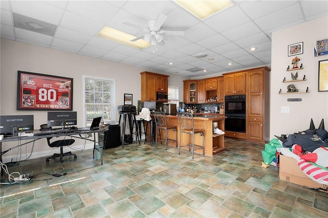 104 Aspen Dr NE, Calhoun, GA 30701 - office area with a drop ceiling, ceiling fan, and light stone finish floors