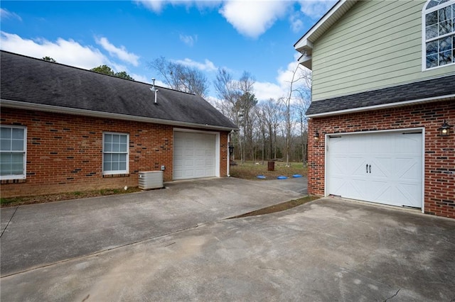 104 Aspen Dr NE, Calhoun, GA 30701 - garage featuring driveway and central AC