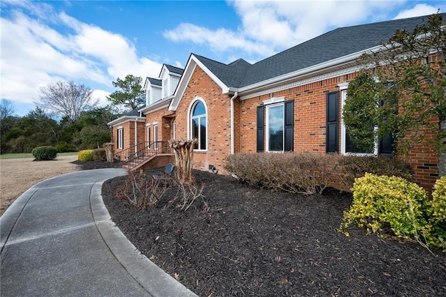 104 Aspen Dr NE, Calhoun, GA 30701 - view of home's exterior featuring brick siding and a shingled roof