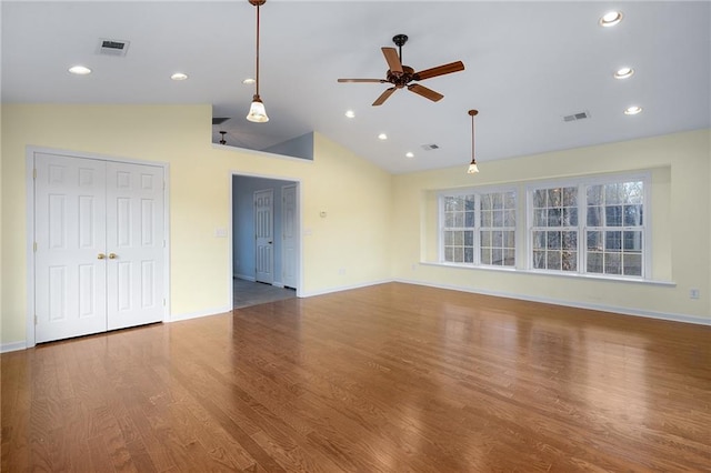 104 Aspen Dr NE, Calhoun, GA 30701 - unfurnished living room with a ceiling fan, lofted ceiling, wood finished floors, baseboards, and recessed lighting