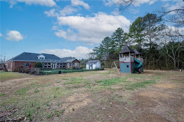 104 Aspen Dr NE, Calhoun, GA 30701 - view of yard with a playground and an outbuilding