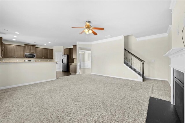 1566 Wilson Manor Cir, Lawrenceville, GA 30045 - unfurnished living room featuring carpet floors, ornamental molding, stairway, and a fireplace