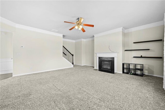 1566 Wilson Manor Cir, Lawrenceville, GA 30045 - unfurnished living room featuring baseboards, a fireplace with flush hearth, ceiling fan, carpet, and crown molding