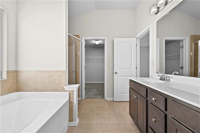 1566 Wilson Manor Cir, Lawrenceville, GA 30045 - full bath featuring a garden tub, a spacious closet, tile patterned flooring, and a shower stall