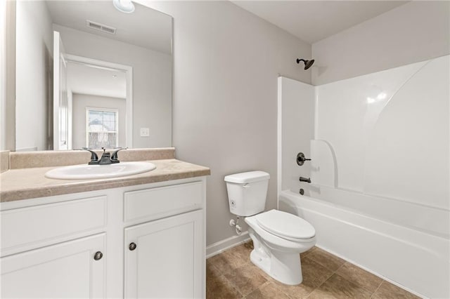 bathroom with bathtub / shower combination, toilet, vanity, visible vents, and baseboards