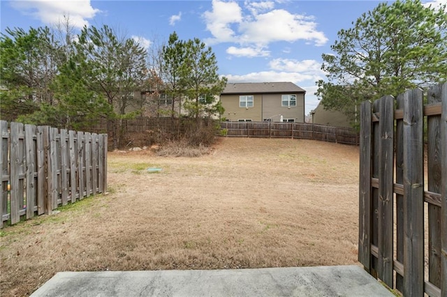 view of yard with a fenced backyard