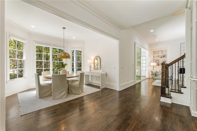 unfurnished dining area featuring ornamental molding, dark hardwood / wood-style flooring, and built in shelves