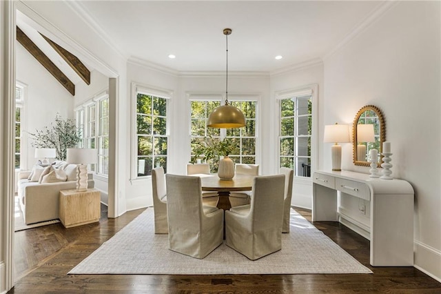 dining area with ornamental molding, vaulted ceiling, and dark hardwood / wood-style floors