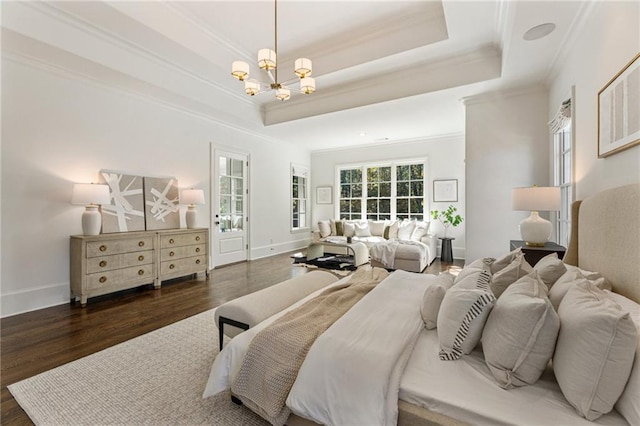 bedroom featuring ornamental molding, a notable chandelier, dark hardwood / wood-style floors, and a raised ceiling