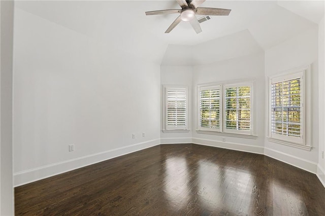 spare room with ceiling fan, lofted ceiling, and dark hardwood / wood-style flooring