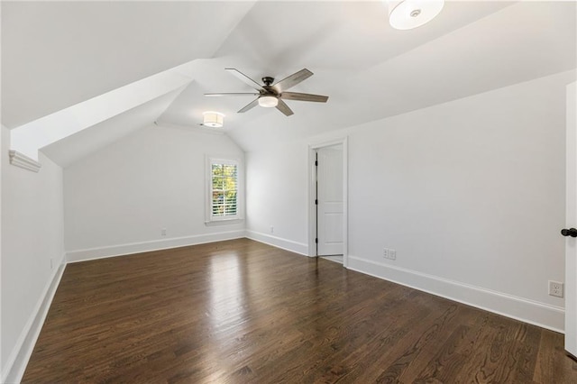 bonus room with lofted ceiling, dark hardwood / wood-style floors, and ceiling fan