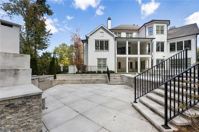 back of property with a patio area