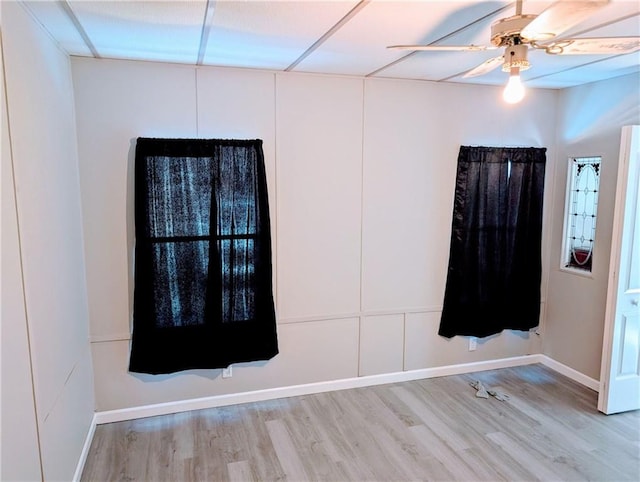 empty room featuring ceiling fan and wood-type flooring