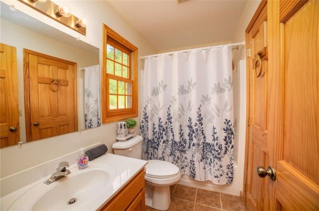 bathroom with tile patterned floors, toilet, vanity, and shower / bathtub combination with curtain