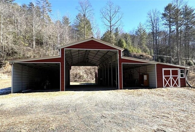 garage featuring a carport