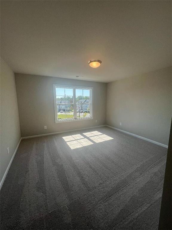 unfurnished room with carpet flooring