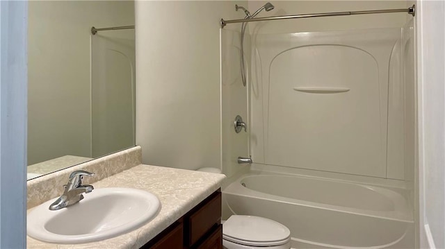 full bathroom with  shower combination, vanity, and toilet