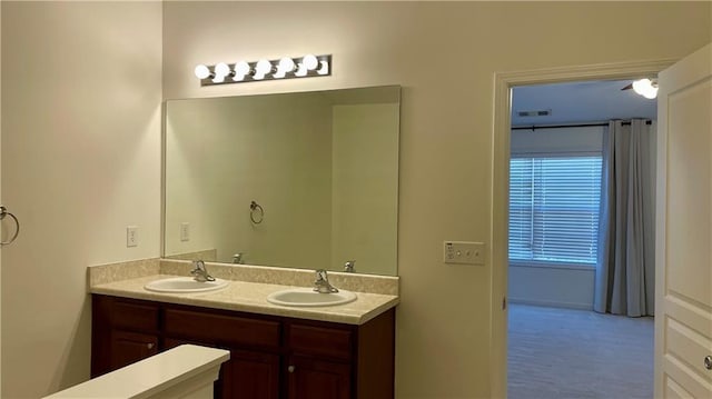 full bath with double vanity and a sink