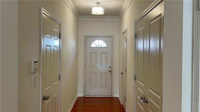 doorway to outside with dark wood-style flooring, crown molding, and baseboards