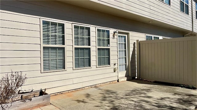 view of property exterior featuring fence