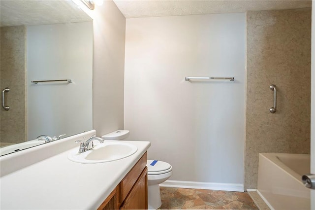 full bathroom with toilet, baseboards, a textured ceiling, and vanity