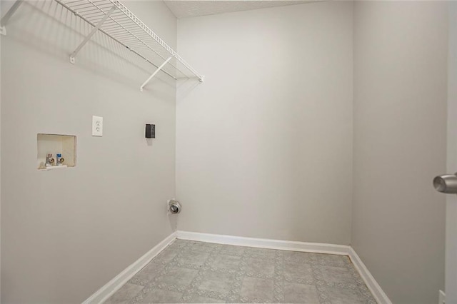 washroom featuring hookup for a washing machine, laundry area, electric dryer hookup, and baseboards