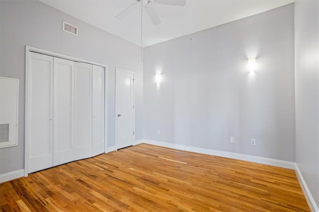 unfurnished bedroom with baseboards, visible vents, and light wood-style floors