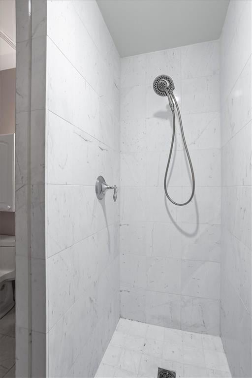 bathroom with tiled shower