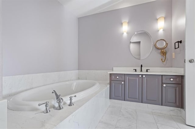 full bath with vanity, a bath, and marble finish floor