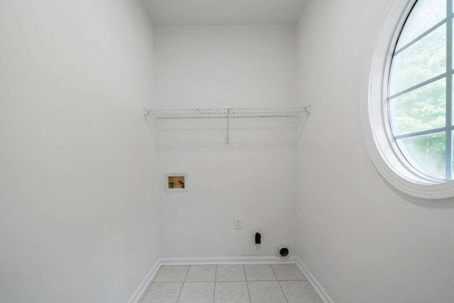 1460 Bakers Bridge Rd, Douglasville, GA 30134 - laundry room featuring hookup for a washing machine, light tile patterned floors, and baseboards