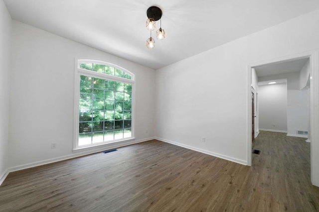 1460 Bakers Bridge Rd, Douglasville, GA 30134 - unfurnished room with plenty of natural light, wood finished floors, and baseboards