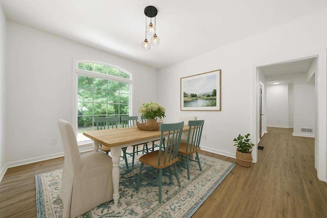 1460 Bakers Bridge Rd, Douglasville, GA 30134 - dining area with baseboards and wood finished floors