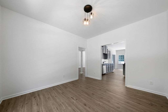 1460 Bakers Bridge Rd, Douglasville, GA 30134 - unfurnished living room with dark wood-style floors and baseboards