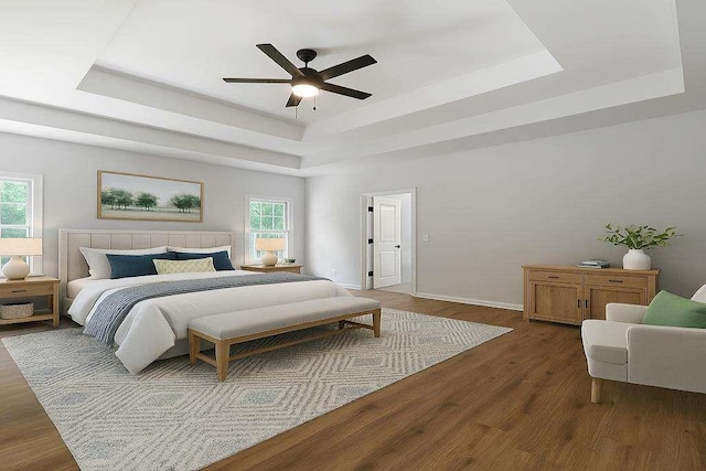 1460 Bakers Bridge Rd, Douglasville, GA 30134 - bedroom featuring a raised ceiling, dark wood finished floors, ceiling fan, and baseboards